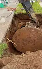 image of oil tank being removed by Steve Rich Environmental Contractors
