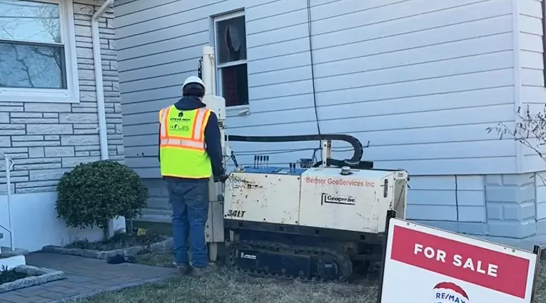 Steve Rich technician testing soil prior to oil tank removal. Questions on the process found below.